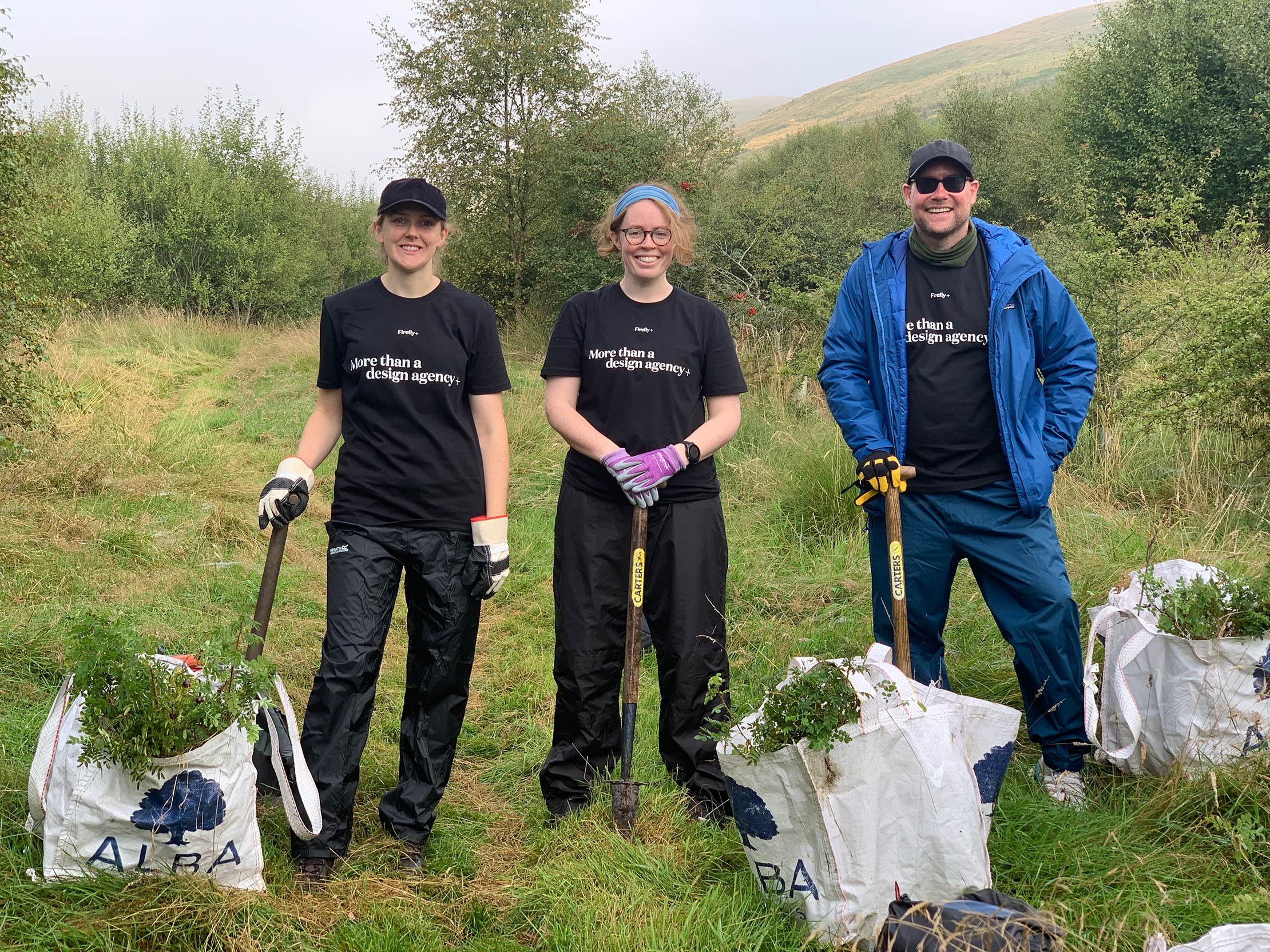 The Firefly team tree planting for Borders Forest Trust.