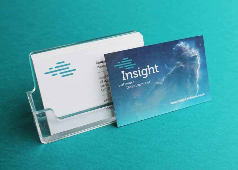 A small pile of Insight Software Development business cards, front and back.