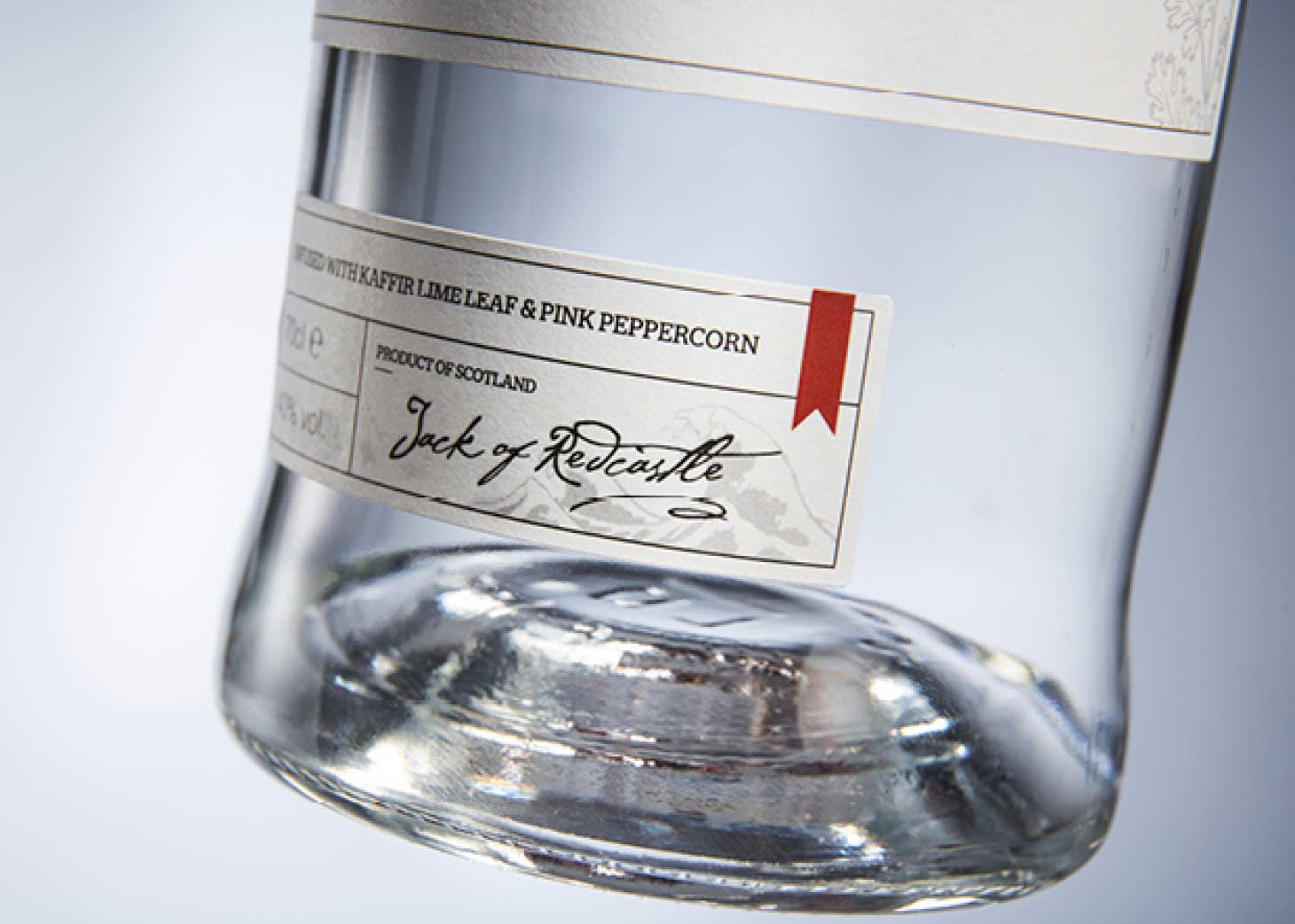 Zoomed-in gin bottle label, showing a signature "Jack of Redcastle".